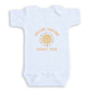 A white baby onesie with a sun graphic and text that reads "Welcome sunshine August 2028".