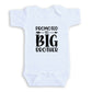 A white baby onesie with the text "PROMOTED TO BIG BROTHER" printed on it.