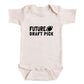A baby onesie with the text "FUTURE DRAFT PICK" printed on it.