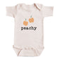A baby onesie with a peach design and the word "peachy" printed on it.