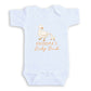 A white baby onesie with a graphic design of two ducks, one larger and one smaller, along with the text "GRANDMA'S Lucky Duck".