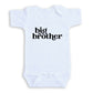 A white baby onesie with the text "big brother" printed on it.