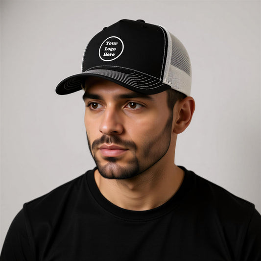 A man wearing a black baseball cap with a white logo on it.