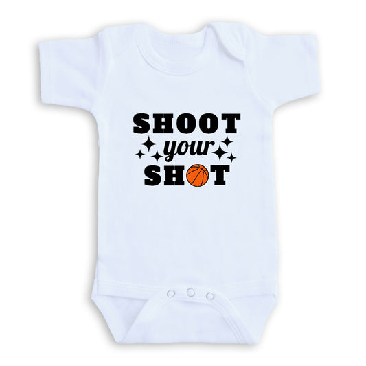 A white baby onesie with the text "SHOOT YOUR SHOT" printed on it.