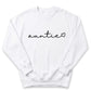 A white sweatshirt with the word "auntie" written in a cursive font.