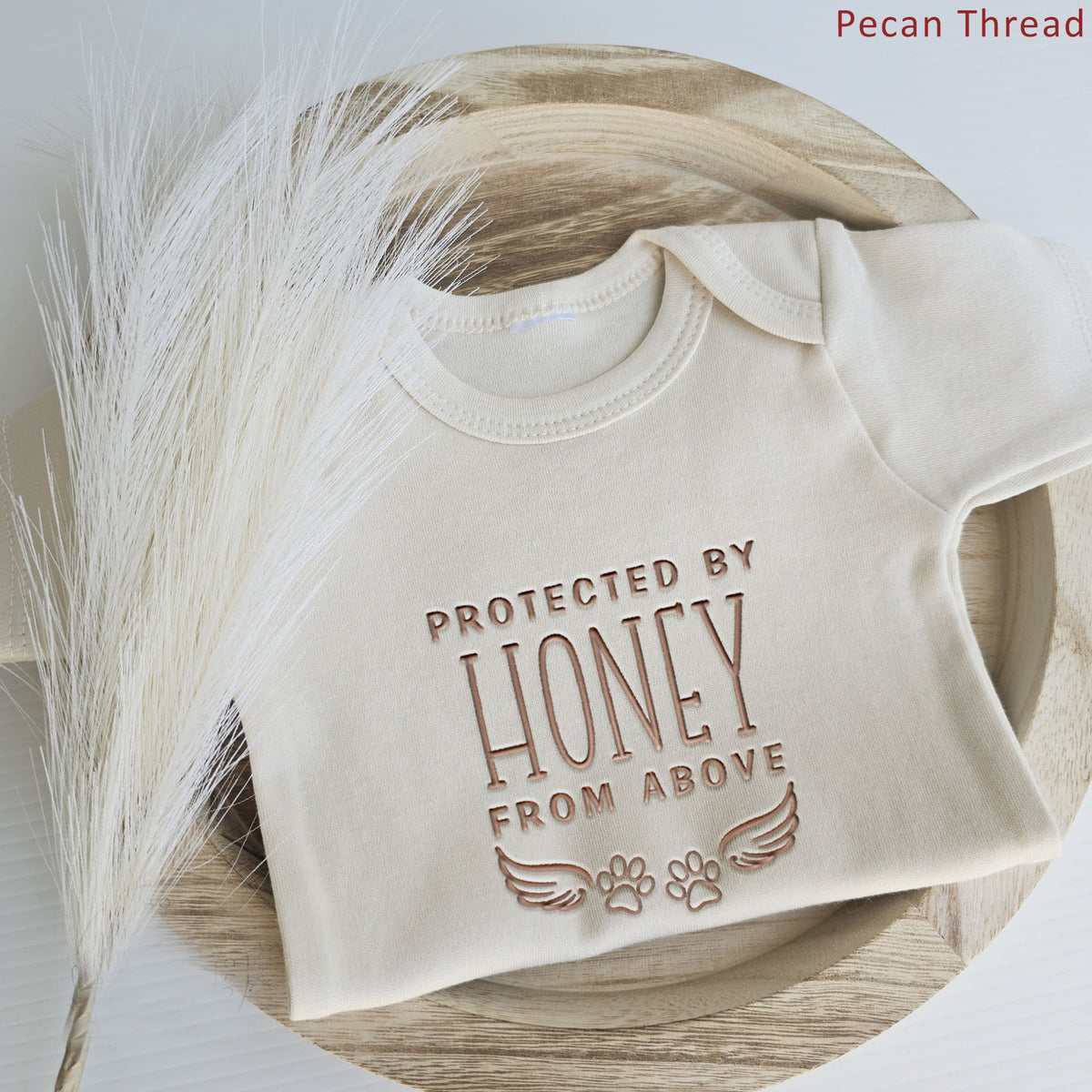 Custom Protected By Our Pet From Above ONESIES® | Dog Name Embroidery Z198