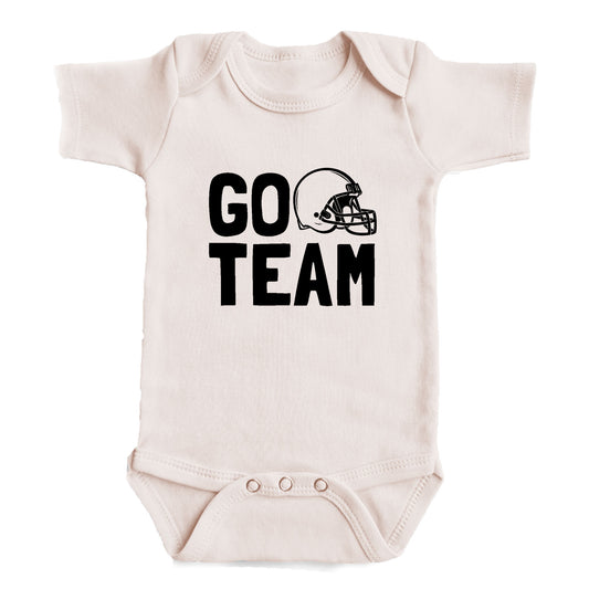 A baby onesie with the text "GO TEAM" printed on it.