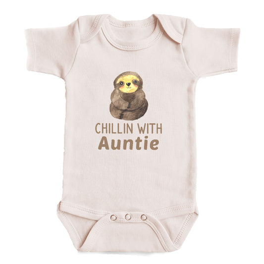 A baby onesie with a sloth graphic and the text "Chillin with Auntie" printed on it.