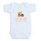 A white baby onesie with an image of acorns and the text "FALL IN LOVE November 2027" printed on it.