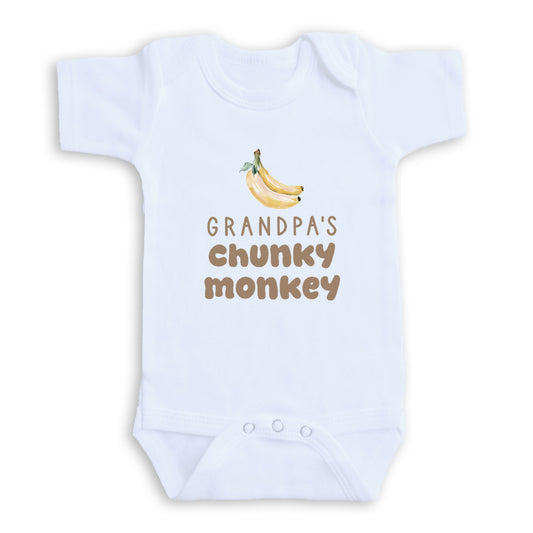 A white baby onesie with a printed design of bananas and the text "GRANDPA'S CHUNKY MONKEY" printed on it.