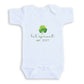 A white baby onesie with a green clover design and the text "Lil' sprout est. 2027" printed on it.