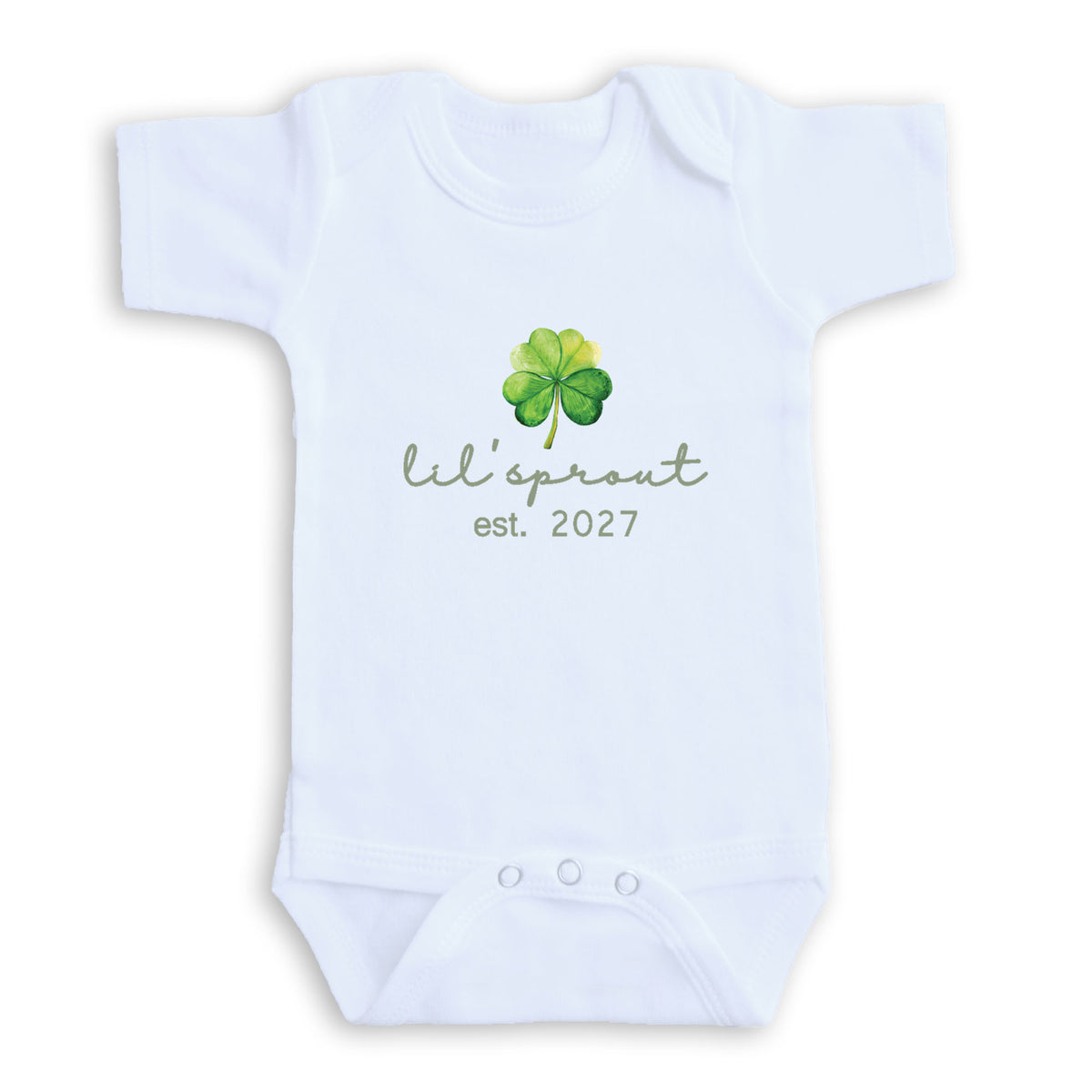 A white baby onesie with a green clover design and the text "Lil' sprout est. 2027" printed on it.