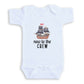 A white baby onesie with a graphic of a pirate ship and the text "new to the crew" printed on it.