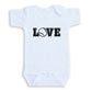 A white baby onesie with the word "LOVE" printed on it in a bold, capitalized font.