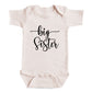A baby onesie with the text "big Sister" printed on it.
