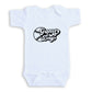 A white baby onesie with the text "Game Day" printed on it.
