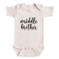 A baby onesie with the text "middle brother" printed on it.