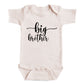 A baby onesie with the text "big brother" printed on it.