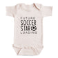 A baby onesie with the text "FUTURE SOCCER STAR LOADING" printed on it.