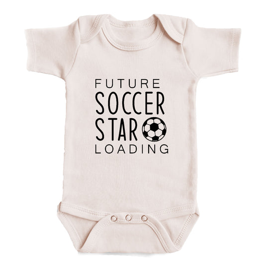 A baby onesie with the text "FUTURE SOCCER STAR LOADING" printed on it.