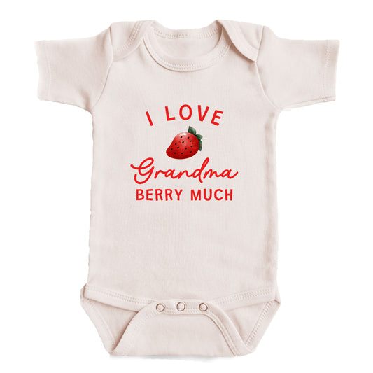 A white baby onesie with a red strawberry graphic and the text "I LOVE Grandma Berry Much" printed on it.