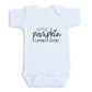 A white baby onesie with the text "LITTLE PUMPKIN COMING SOON!" printed on it.