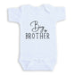 A white baby onesie with the text "Big Brother" printed on it.