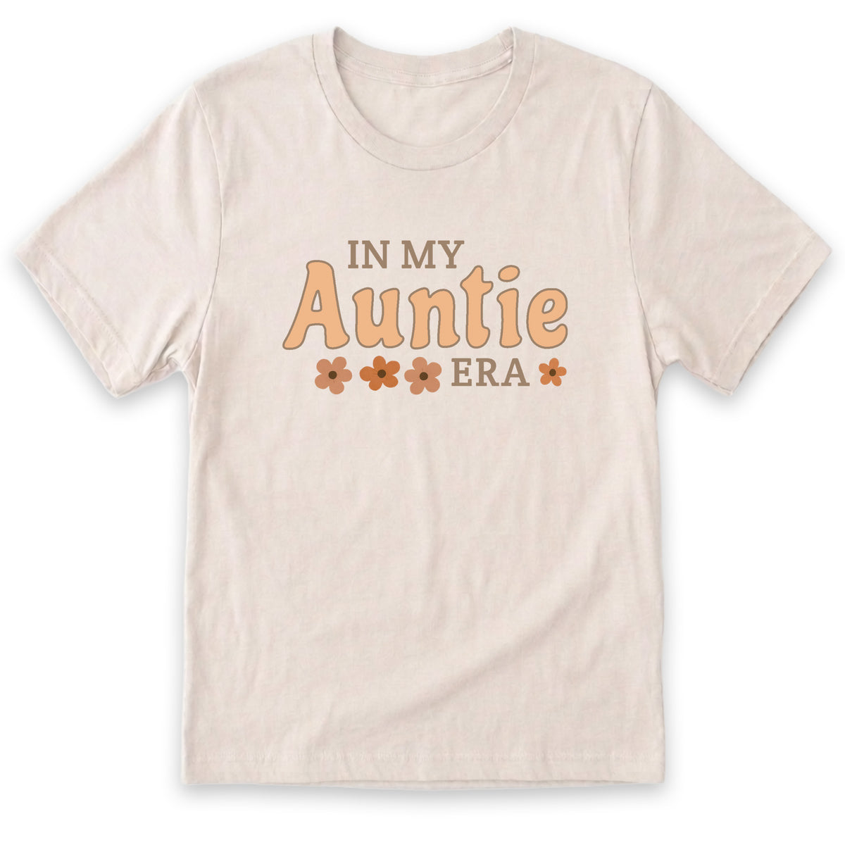 A beige t-shirt with the text "IN MY AUNTIE ERA" printed on it.