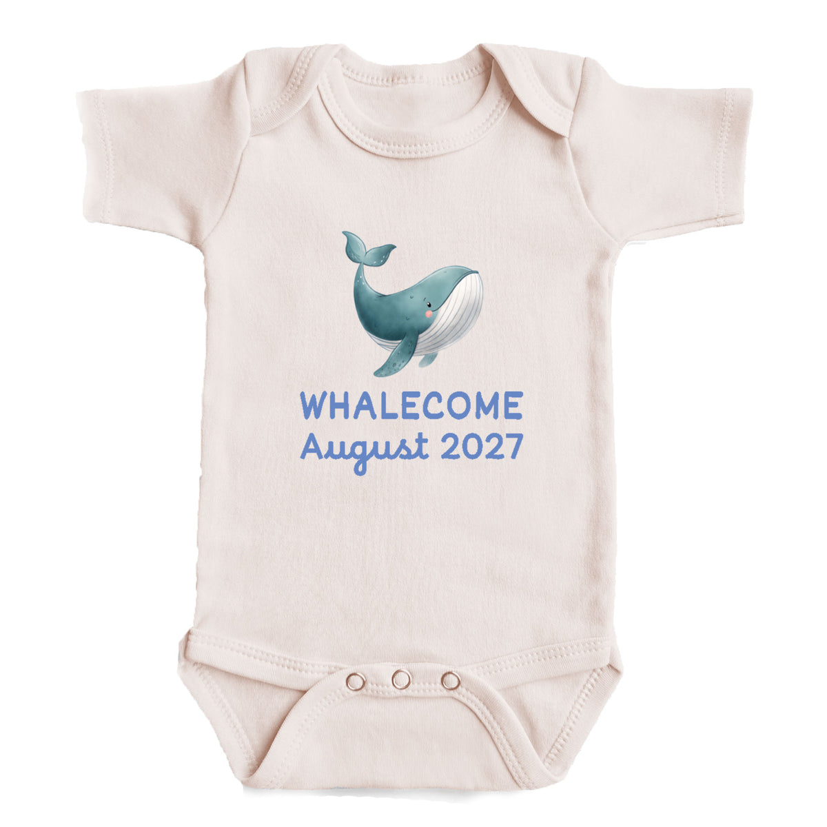 A baby onesie with a graphic of a whale and the text "Whalecoming August 2027" printed on it.