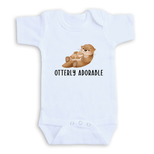 A white baby onesie with a graphic of an otter and the text "OTTERLY ADORABLE" printed on it.