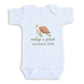A white baby onesie with a graphic of a turtle and the text "making a splash September 2028" printed on it.