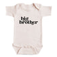A baby onesie with the text "big brother" printed on it.