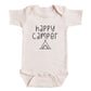 A baby onesie with the text "happy camper" printed on it.