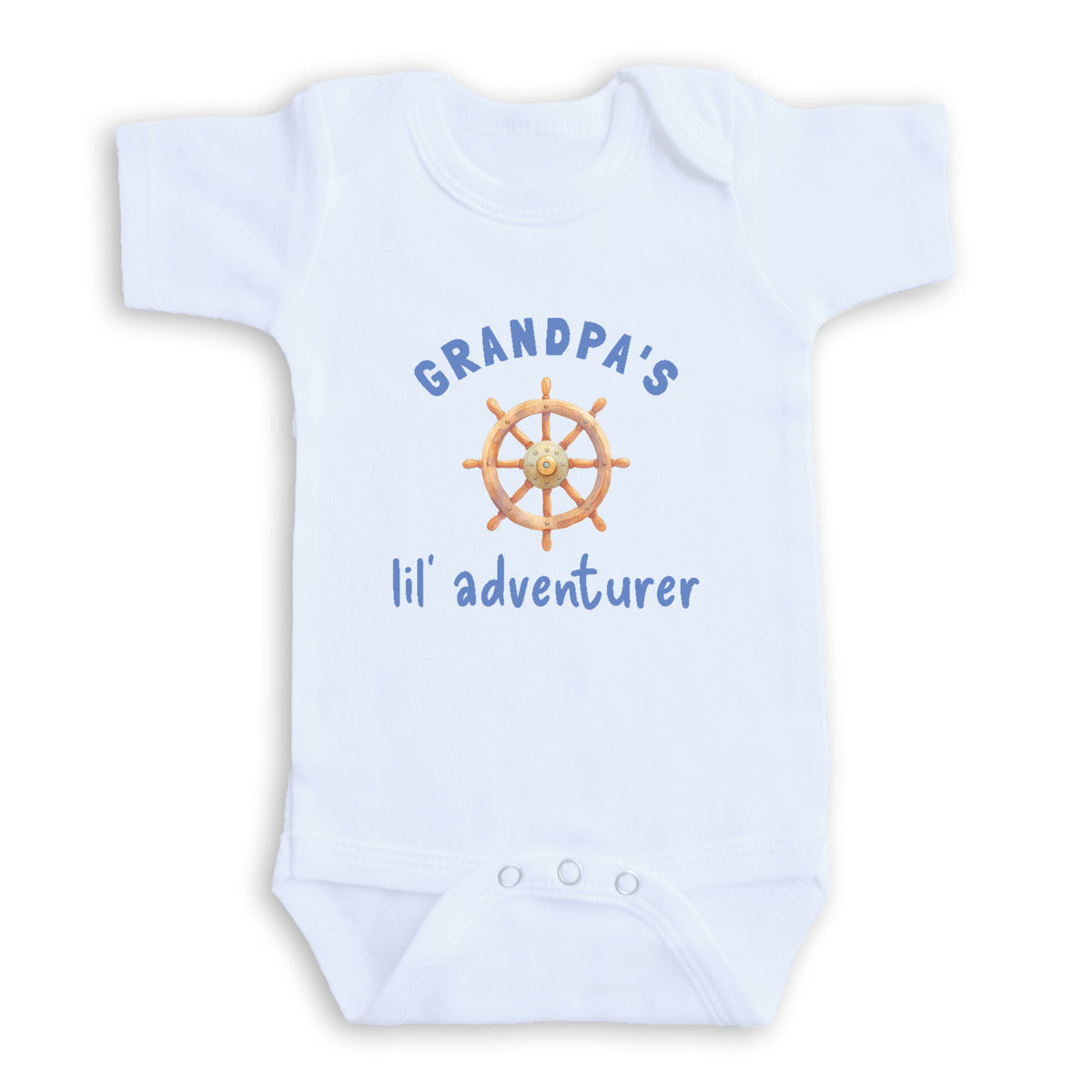 A white baby onesie with a graphic of a ship's steering wheel and the text "GRANDPA'S lil' adventurer" printed on it.