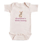 A baby onesie with a bunny image and the text "Grandma's little bunny" printed on it.