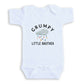 A white baby onesie with a graphic design and text printed on it.
