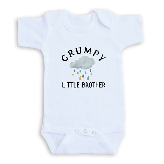 A white baby onesie with a graphic design and text printed on it.