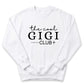 A white sweatshirt with the text "the cool GIGI club" printed on it.